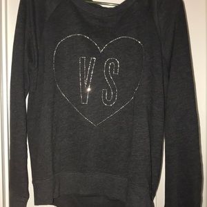 A Victoria’s Secret gray sweatshirt